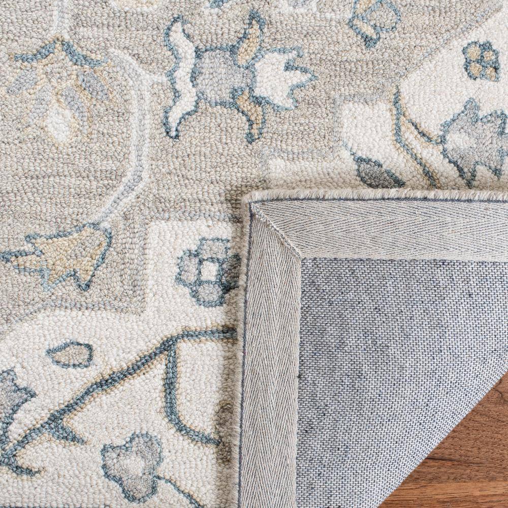Light Grey and Ivory Handmade Wool 8' x 10' Tufted Rug