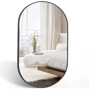 20 in. W x 28 in. H Black Oval Brush Metal Framed Vanity Mirror