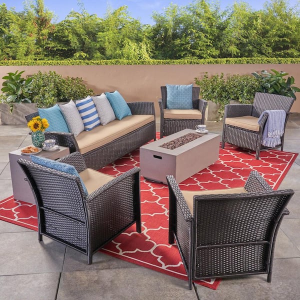 Noble House St. Lucia Brown 7-Piece Faux Rattan Patio Fire Pit Conversation Set with Tan Cushions