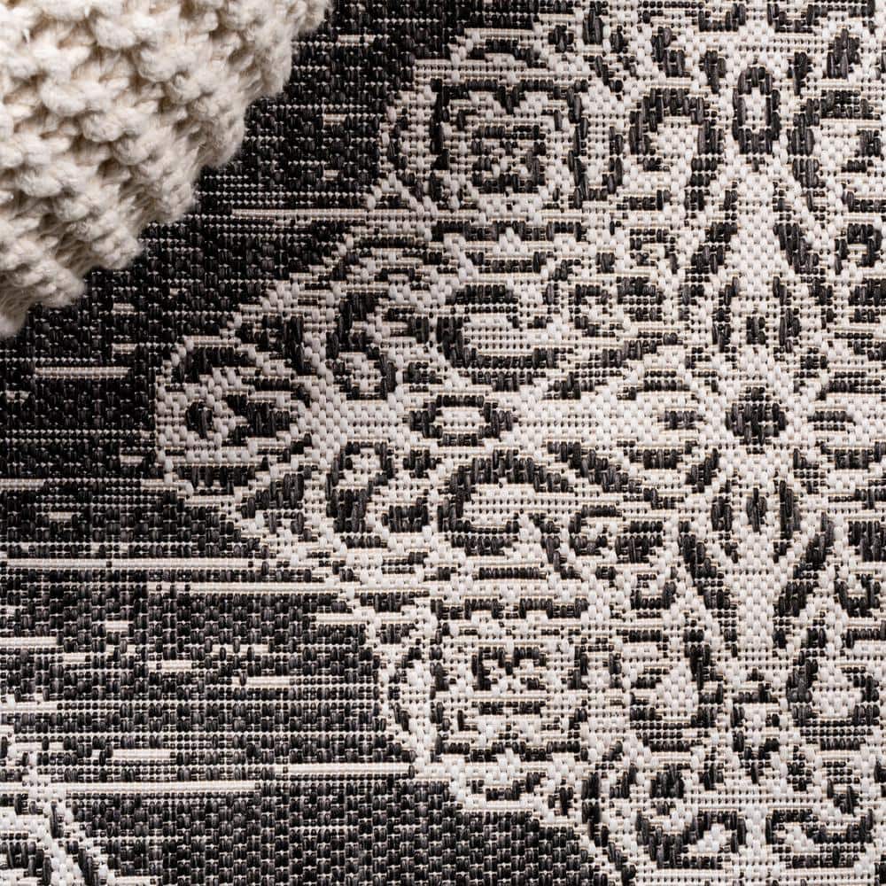 Black and Ivory Medallion Synthetic 8' x 10' Indoor/Outdoor Rug