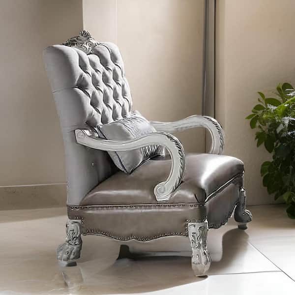 Benjara White Faux Leather Arm Chair with Pillow and Carved Button Tufted Back