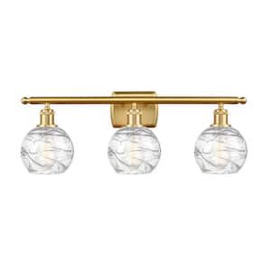 Athens Deco Swirl 26 in. 3-Light Satin Gold Vanity Light with Clear Deco Swirl Glass Shade