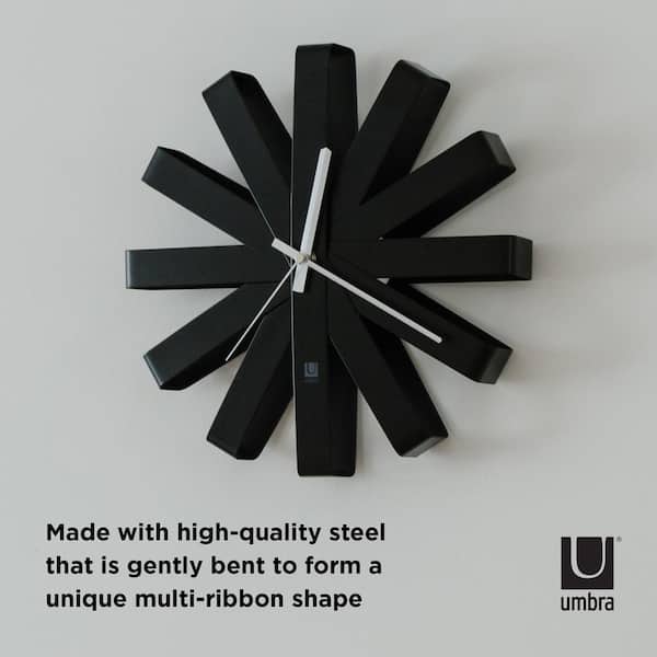 Umbra - This gorgeous modern clock has a natural finish and is made from  bent beechwood that has been formed into a folded ribbon shape, with each  folded ribbon representing an hour