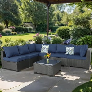 Black 7-Piece Wicker Outdoor Sectional Set with Glass Table and Dark Blue Cushions