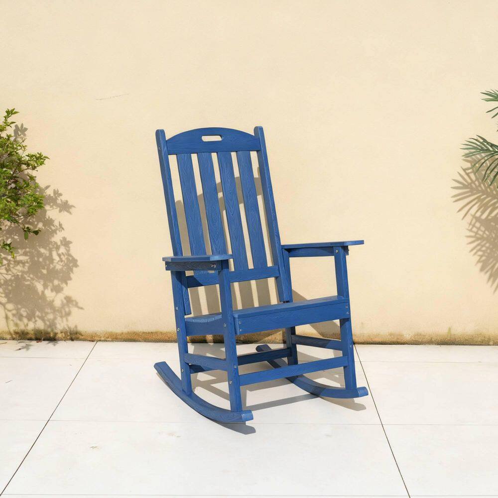 Three-quarter view of a navy blue rocking chair.