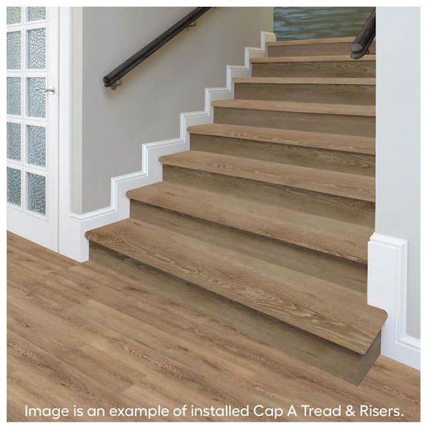 https://images.thdstatic.com/productImages/2fb464ce-f38c-4799-a0c5-66a9ac16b1c1/svn/virgil-island-oak-cap-a-tread-laminate-stair-treads-01r072015-31_600.jpg