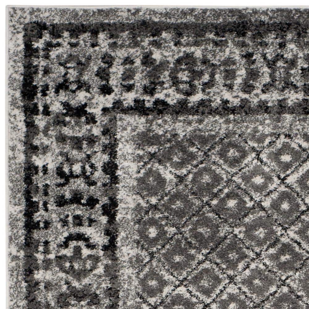 Ivory and Silver Geometric 9' x 12' Synthetic Area Rug