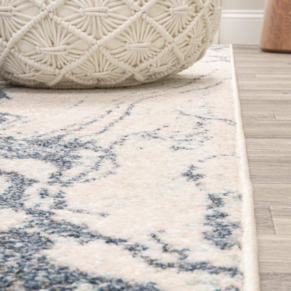Blue and Cream Abstract 8' x 10' Synthetic Area Rug