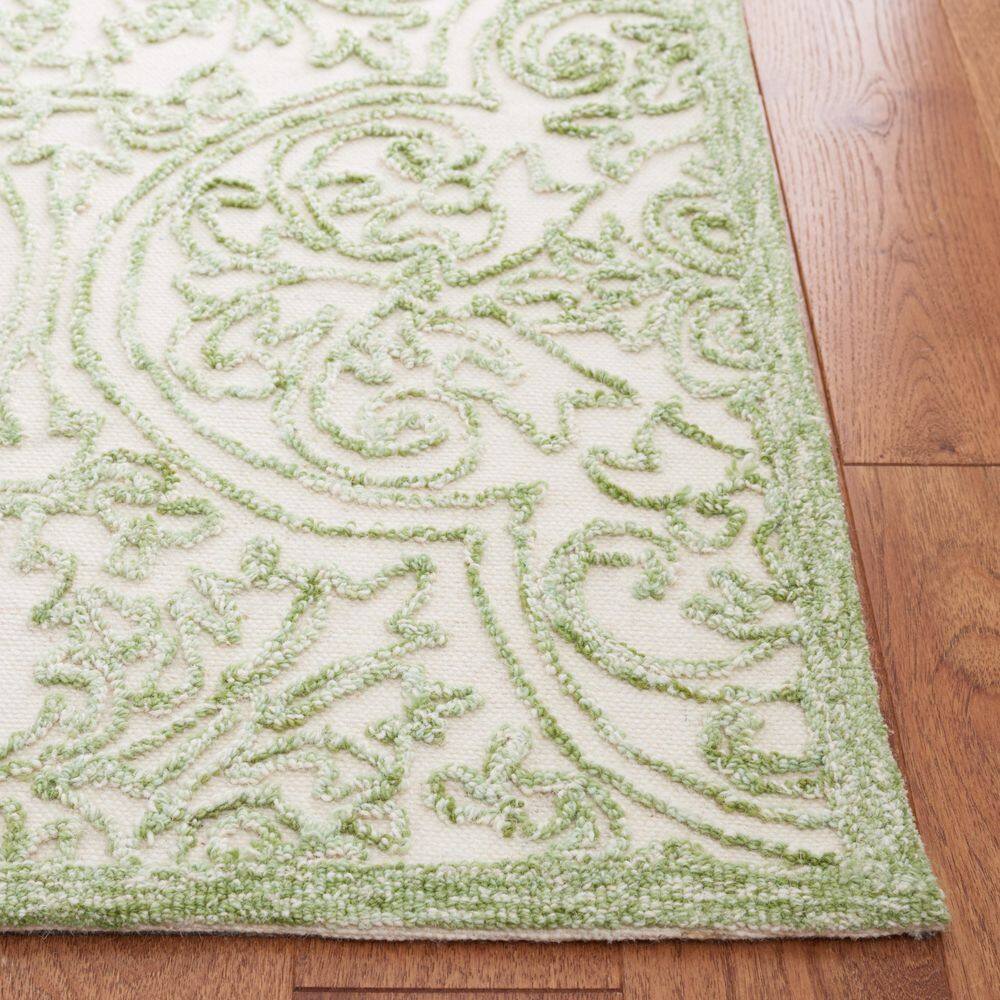 Ivory and Green 9' x 12' Handmade Tufted Wool Area Rug