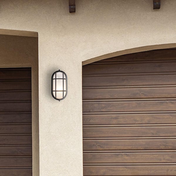 Aria 11 in. 1-Light Rust Oval Bulkhead Outdoor Wall Light Fixture with Ribbed Glass