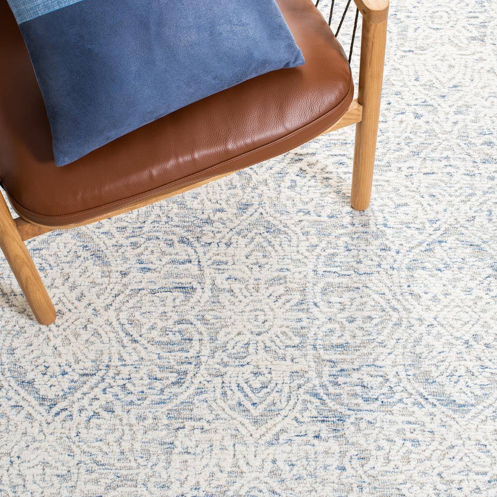Light Blue and Ivory Floral Wool 8' x 10' Handmade Tufted Rug