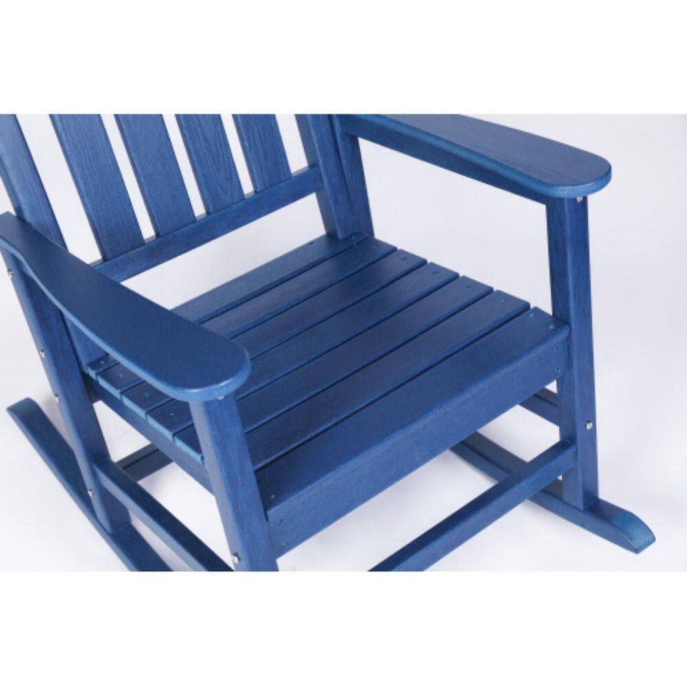 Close-up of the navy blue slatted seat and armrest of a rocking chair.