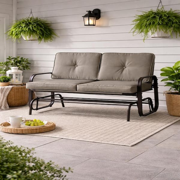 Winston Brown Steel Outdoor Glider Loveseat with tan weather-resistant cushions (2-Person)