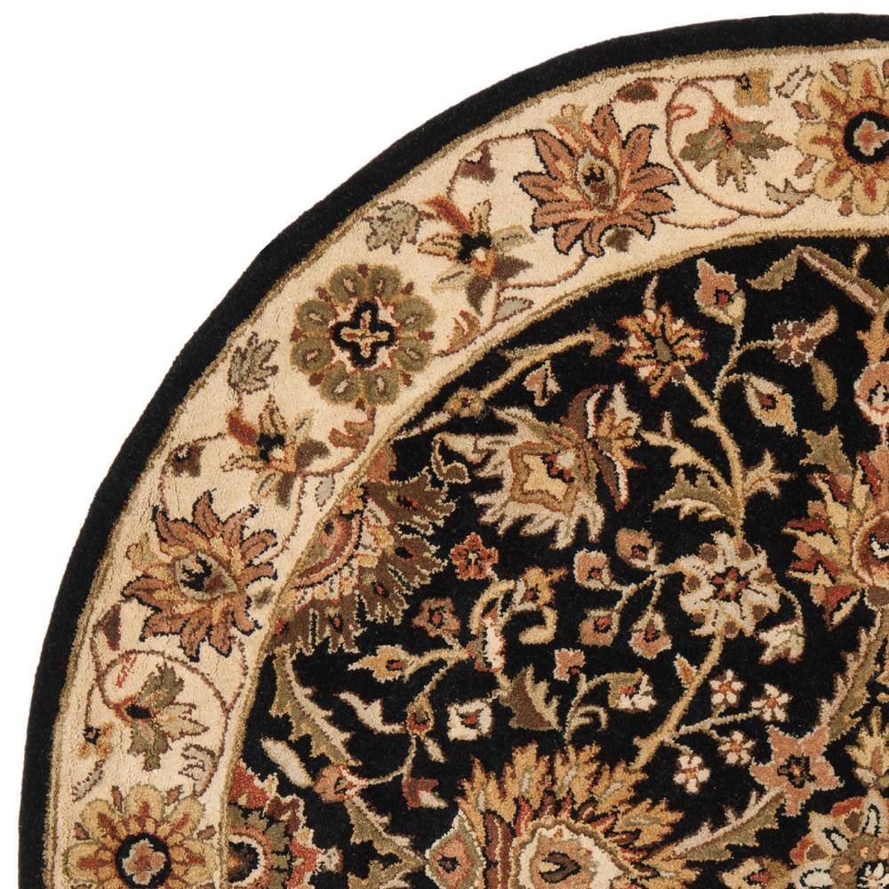 Handmade Black and Ivory Round Wool Tufted Area Rug