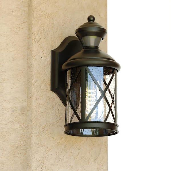 VAXCEL Henderson 1-Light Textured Black Motion Sensor Dusk to Dawn Outdoor Hardwired Wall Lantern Clear Glass, LED Compatible