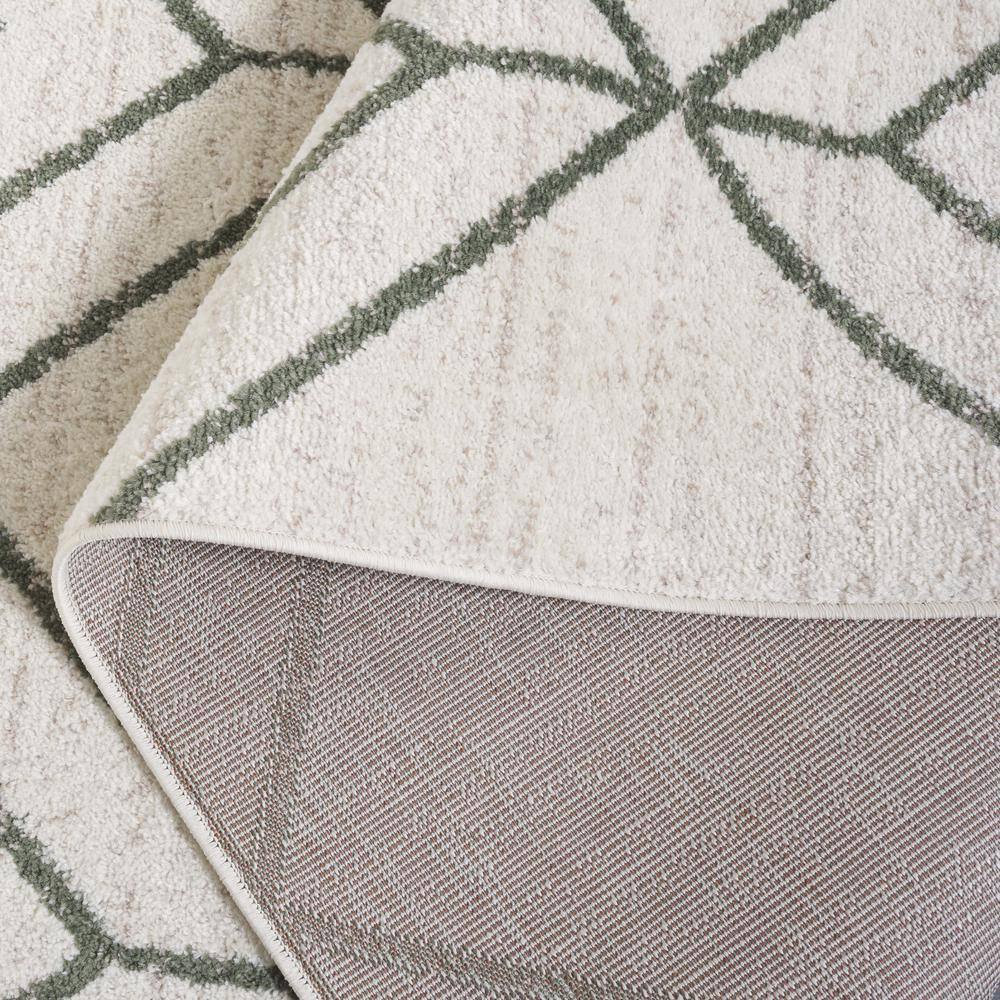 Ivory and Dark Green Geometric Synthetic Area Rug