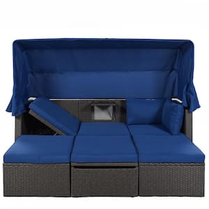 Gray Wicker Outdoor Day Bed with Blue Cushions and Retractable Canopy