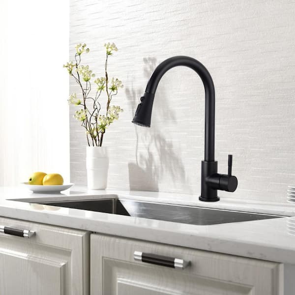 Black Single-Handle Pull-Down Sprayer Kitchen Faucet with Deck Plate in Stainless Steel.
