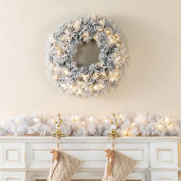 Glitzhome 9 ft. Pre-Lit Snow Flocked White Pine Christmas Garland
