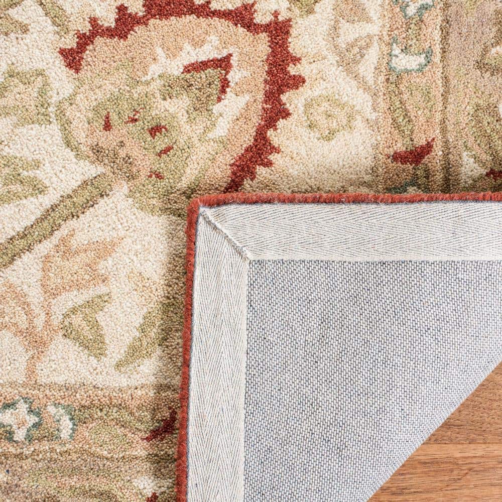 Handmade Beige and Rust Floral Wool Area Rug, 5' x 8'