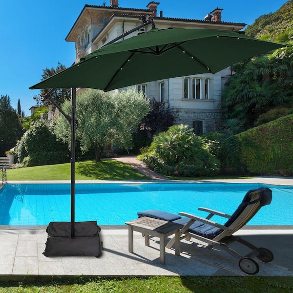 ainfox outdoor 10ft solar cantilever offset hanging patio umbrella Ainfox 10 ft. Steel Cantilever Market Solar LED Outdoor Patio Umbrella in  Green Offset with Base Stand 76XBDSGN
