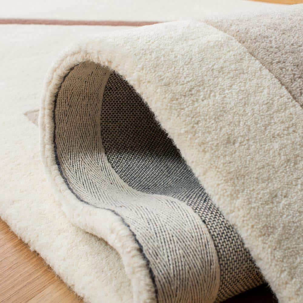 Ivory and Brown Hand Tufted Wool Area Rug