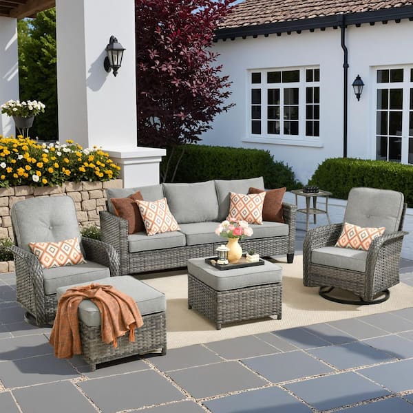 Audrey Gray 6-Piece Wicker Outdoor Patio Conversation Set With Rocking Swivel Chairs and Dark Gray Cushions.