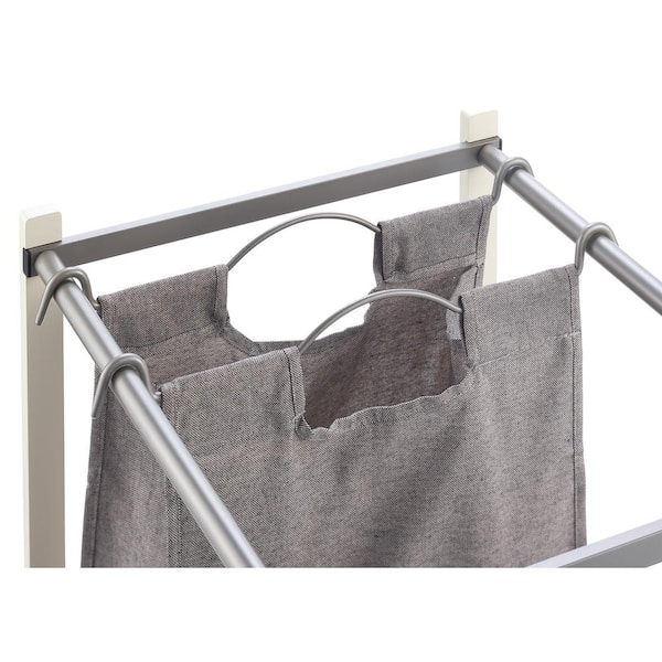 https://images.thdstatic.com/productImages/3156ba8c-63f7-4a5f-b946-e702ea2f7cd2/svn/white-frames-and-champaign-finish-poles-trinity-laundry-sorters-tbfpnc-2104-1f_600.jpg