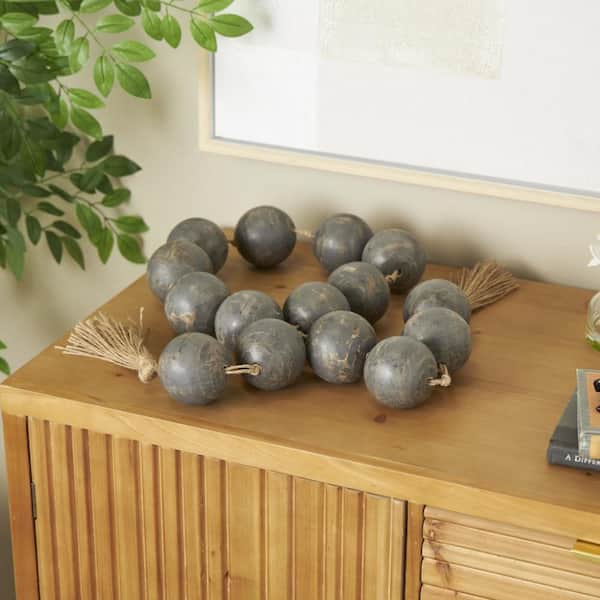 Litton Lane Black Handmade Mango Wood Round Extra Long Orb Garland with Tassel Knotted Brown Jute Decorative Balls