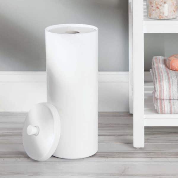 Set of white toilet paper tubes and plastic basket on bathroom floor · Free  Stock Photo