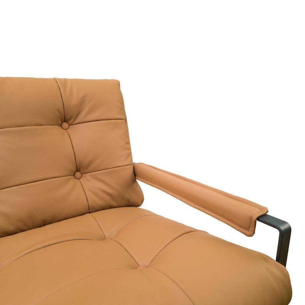 Close-up of the khaki leather armrest and seat of the arm chair.