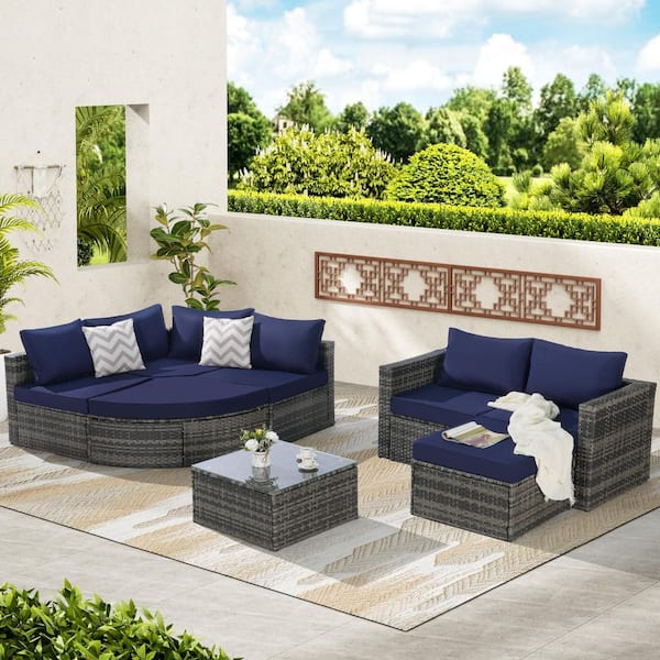 Sudzendf 8-Piece Wicker L-Shaped Patio Conversation Set with Dark Blue Cushions and Ottoman and Glass Top Table for Backyard