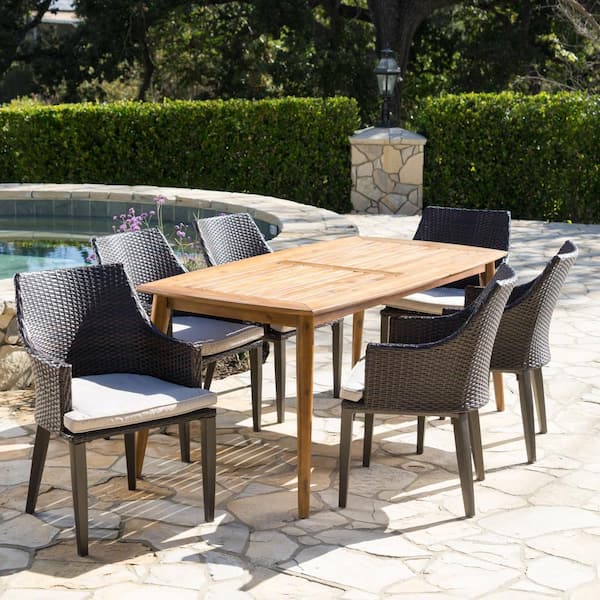 Noble House Brenner Teak Brown and Multi-Brown 7-Piece Wood and Faux Rattan Rectangular Outdoor Dining Set with Light Brown Cushions
