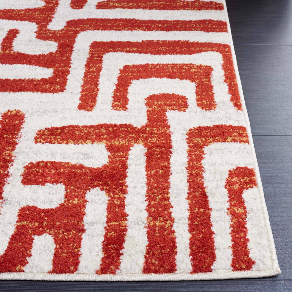 Ivory and Terracotta Geometric Synthetic Area Rug