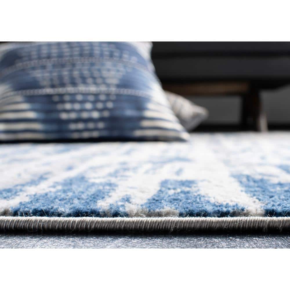 Ivory/Blue Abstract Synthetic 8' x 10' Easy Care Area Rug