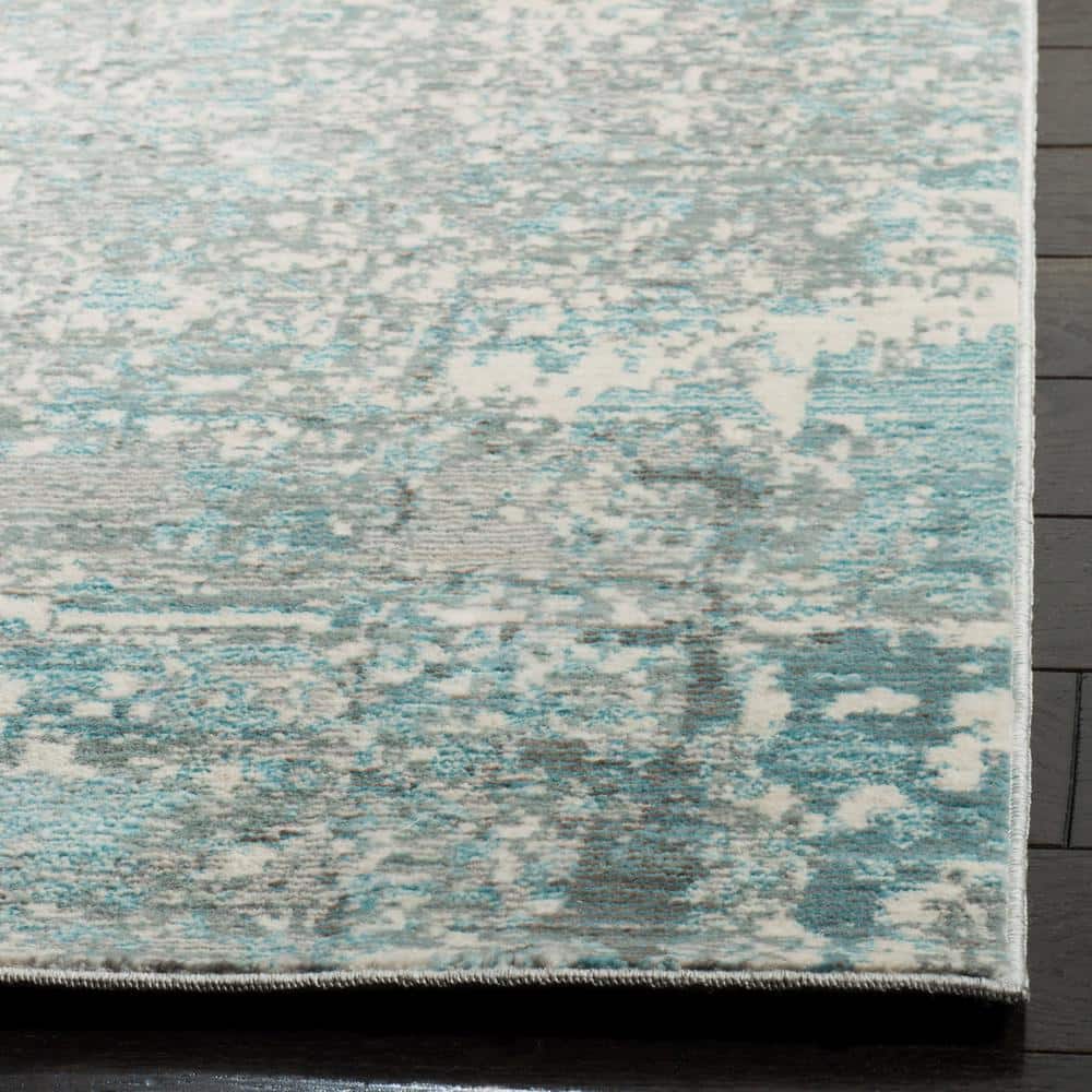 Teal Multi Abstract Synthetic Easy Care 3' x 5' Area Rug