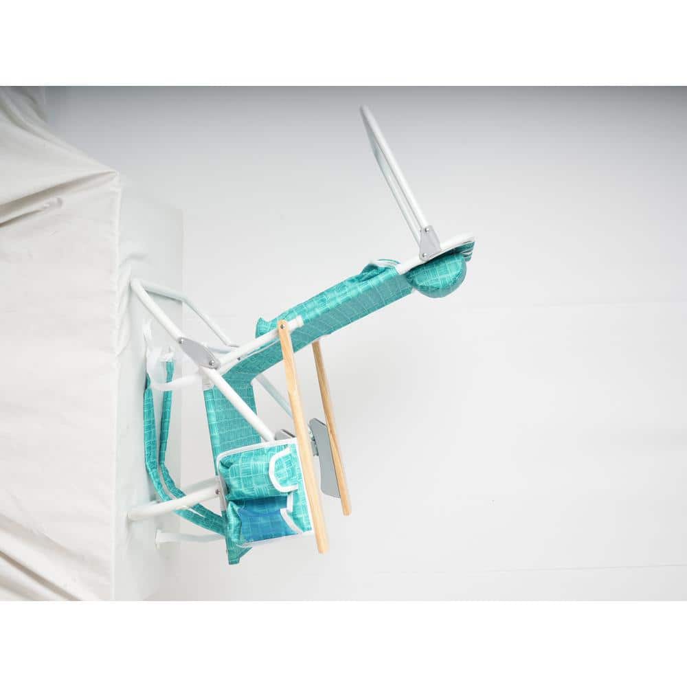 Folding beach chair frame leaning against a white object.