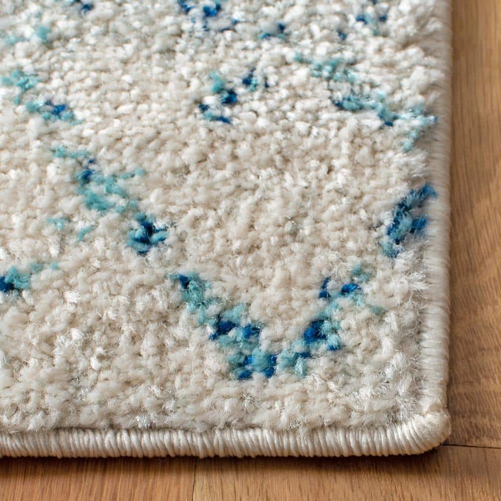 Ivory and Aqua Hand-Knotted Synthetic Area Rug