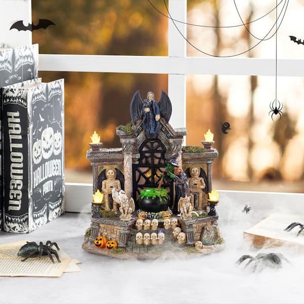 Glitzhome 9.75 in. H Lighted Resin Halloween Haunted House Village