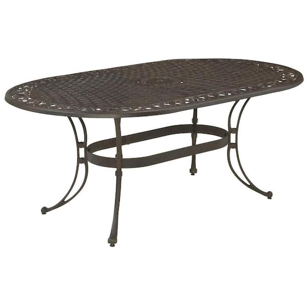 HOMESTYLES Sanibel Rust Bronze 7-Piece Cast Aluminum Oval Outdoor Dining Set with Coral Orange Cushions