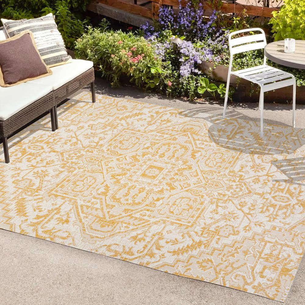 https://images.thdstatic.com/productImages/331d734c-6980-4d87-ad26-6f2cb914d27b/svn/cream-yellow-jonathan-y-outdoor-rugs-smb105h-3-64_1000.jpg