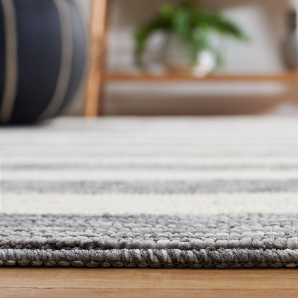 Dark Grey and Ivory Striped 6' x 9' Synthetic Area Rug