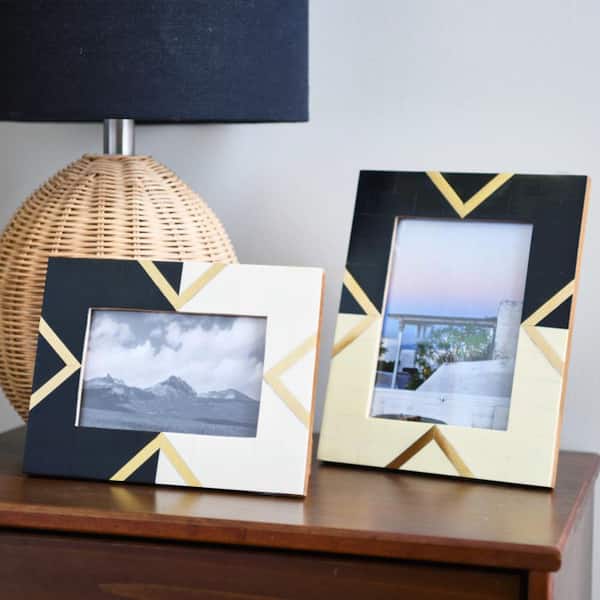 https://images.thdstatic.com/productImages/33869eb9-0b64-4e92-ba86-5dec1760360c/svn/gold-inlay-on-black-and-cream-picture-frames-ec0448-fa_600.jpg