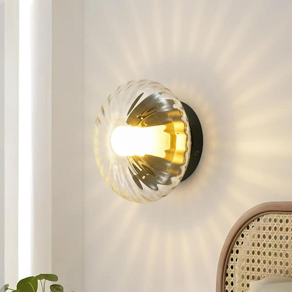 Lyra 1-Light Black Wall Sconce with Pumpkin Shaped Clear Striped Glass Shade and Frosted Inner Tube
