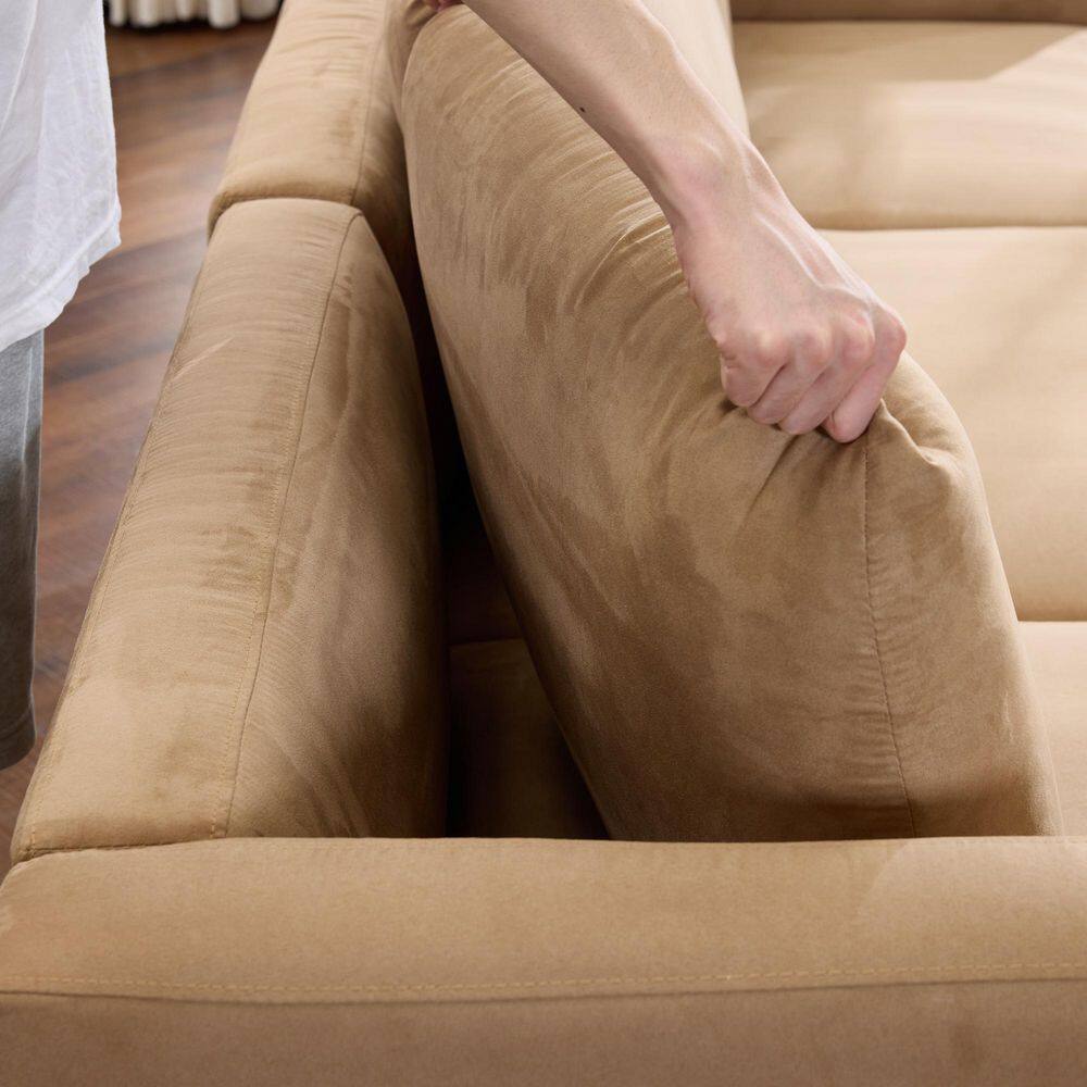 Person sitting on the sectional sofa.