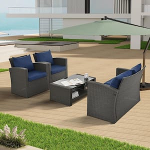 4-piece PE wicker outdoor patio furniture set with coffee table and blue cushions for garden, backyard and balcony