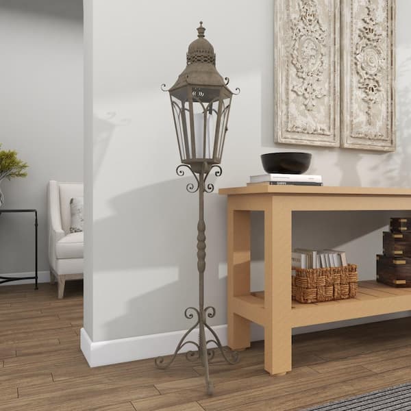 Litton Lane 56 in. H Brown Metal Tall Standing Decorative Candle Lantern