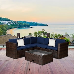 4-Piece Brown Wicker Outdoor Sectional Sofa Set with Dark Blue Cushions and Coffee Table