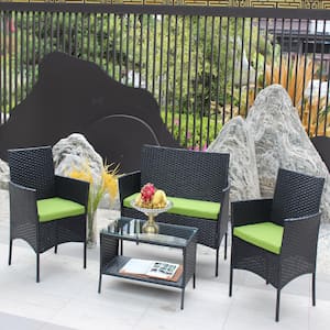 4-Piece Wicker Outdoor Bistro Set with Green Cushion and Rectangular Glass Coffee Table