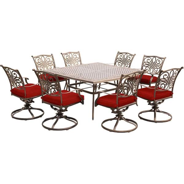 Traditions 9-Piece Aluminum Outdoor Dining Set with Swivel Rockers with Red Cushions